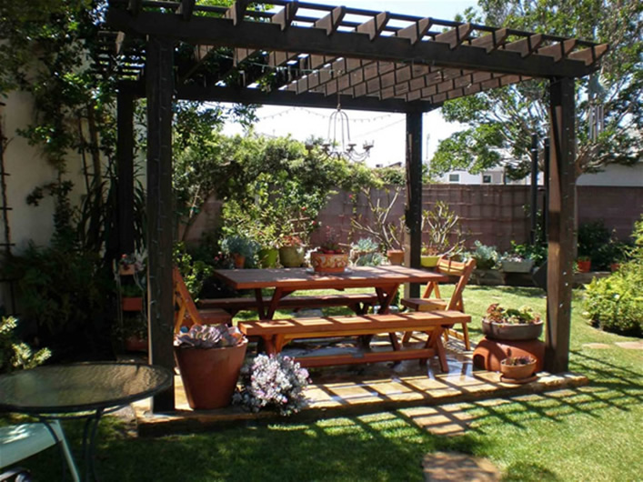 Forever Wooden Garden Pergola in a coffee stain sheltering a Forever Picnic Table (Unattached Benches) By Adrienne H. of Los Angeles, CA.